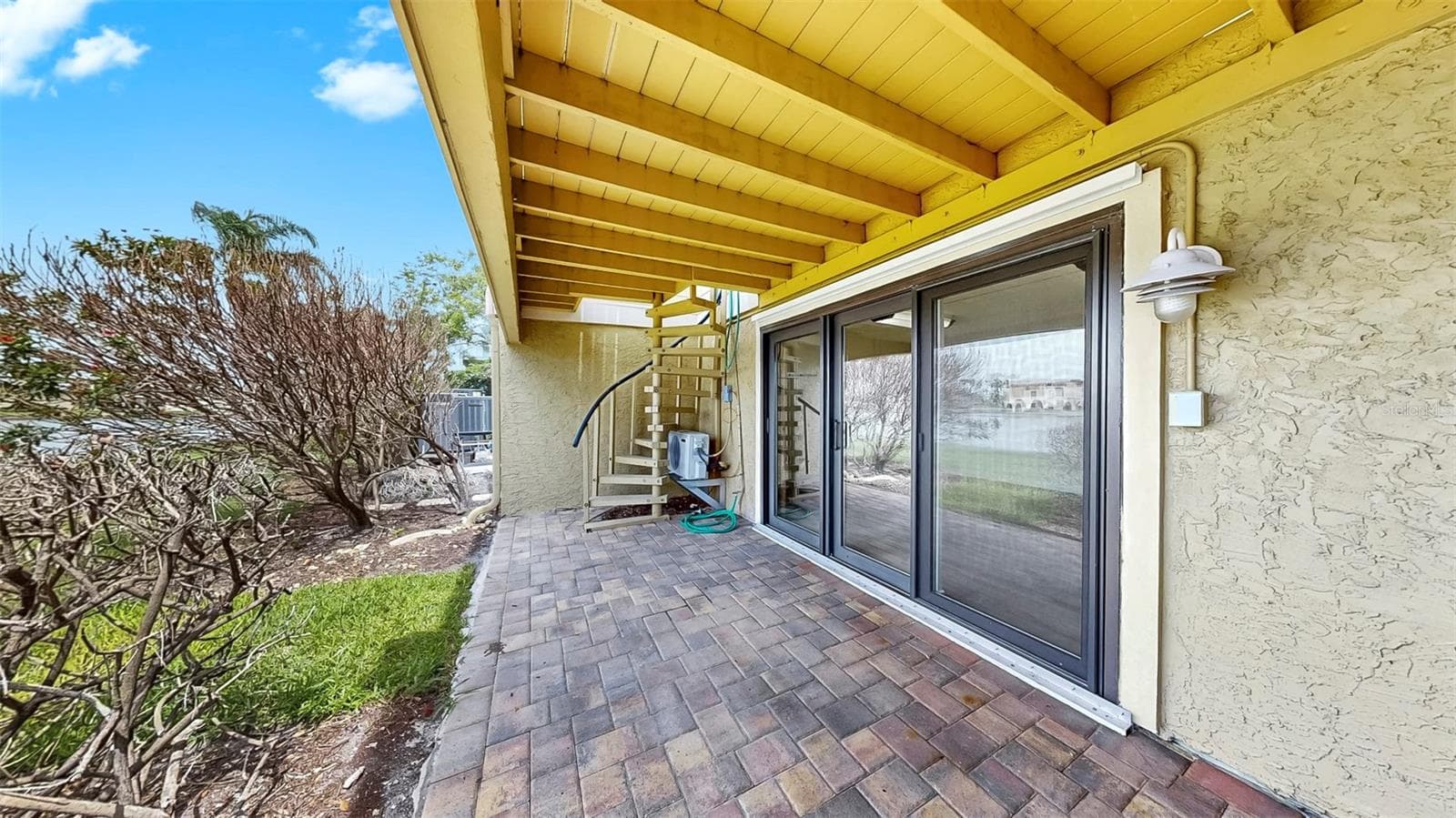 Ground Floor Covered Lanai - Sliders to Bonus Room - 459 HAVEN POINT DR, TREASURE ISLAND