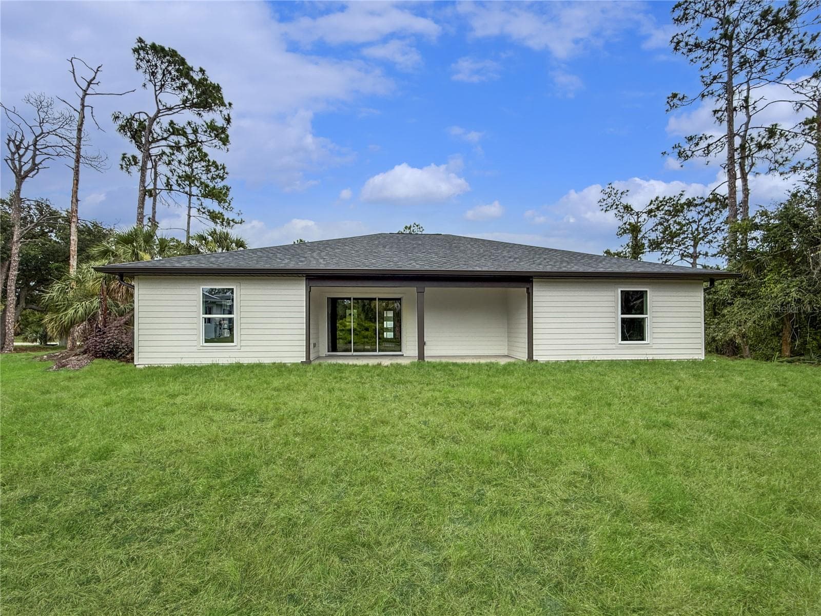 Rear Elevation featuring Covered Lanai - 73 BARSTOW ST, PORT CHARLOTTE
