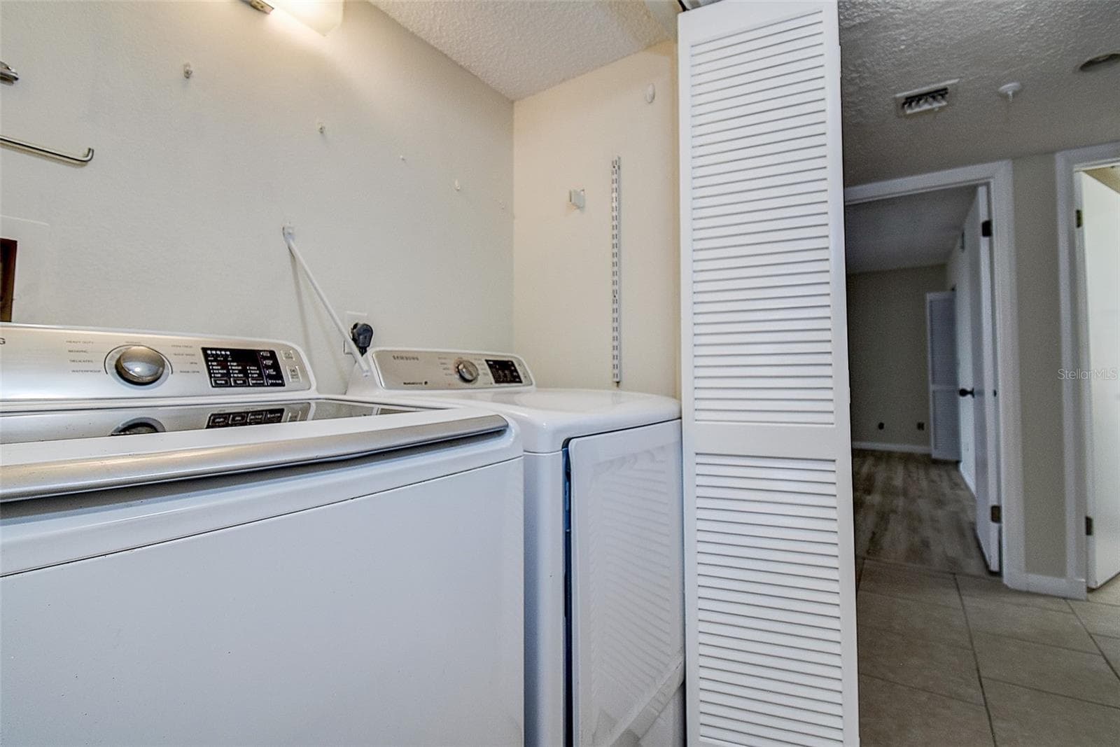 Laundry closet - 5940 PELICAN BAY PLZ S #406, GULFPORT