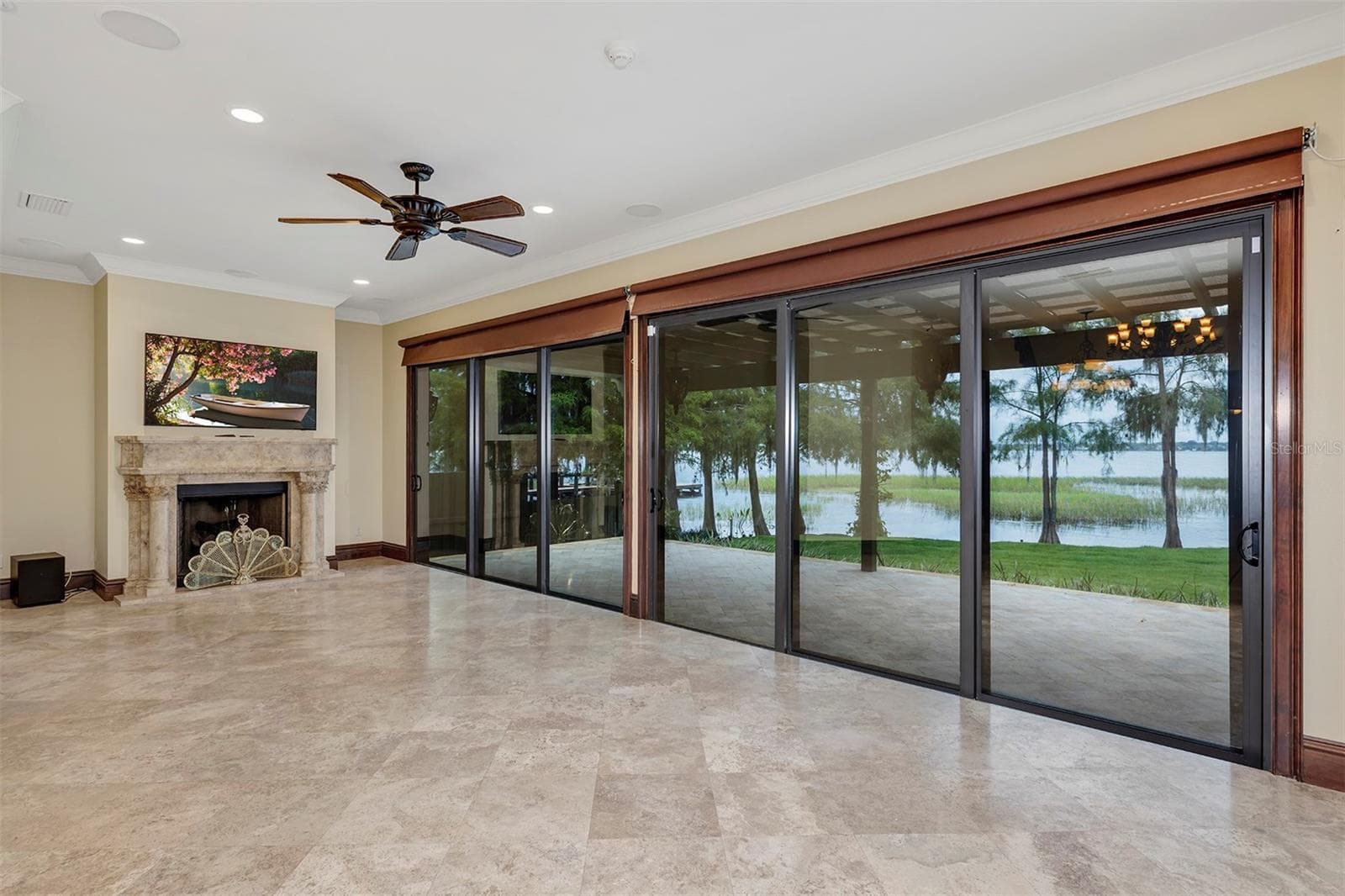 Living Room w/Fireplace and view of Lake Tibet - 10203 TROUT RD, ORLANDO