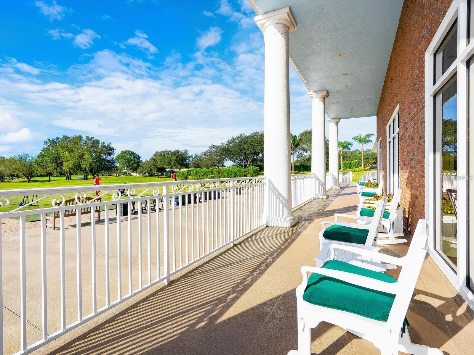 Unwind at the end of a busy day on the long patio overlooking the driving range - 6948 STONEYWALK CT, BRADENTON