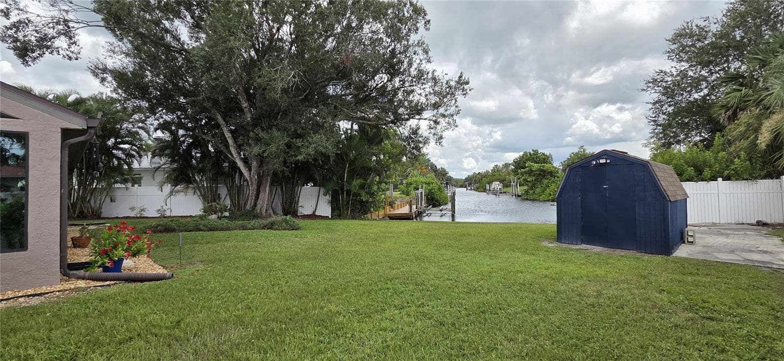 Back yard facing shed and waterway - 2076 RIVER BASIN TER, PUNTA GORDA