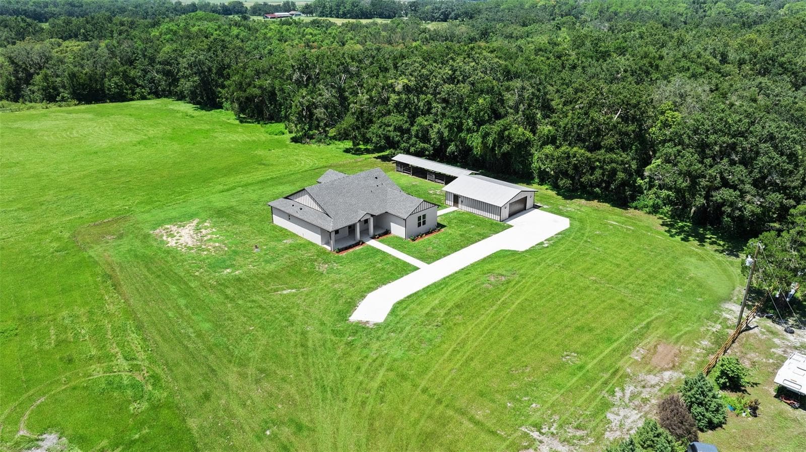 aerial view showing view entering from driveway and north side tree line - 13219 NEWGENT RD, SAN ANTONIO