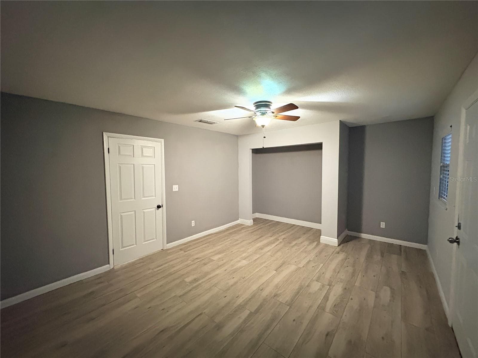 Bedroom 2 with Door to Backyard - 1722 NW 35 ST, OCALA