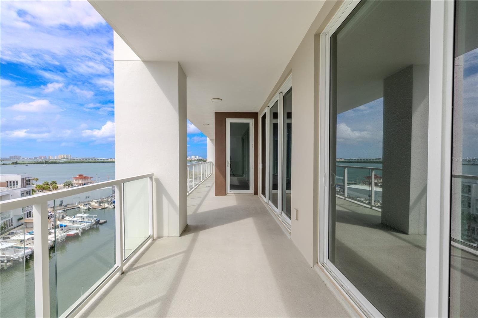 Enjoy stunning views from nearly every room, with floor-to-ceiling glass doors leading to an expansive balcony that invites you to relax and take in the breathtaking scenery. - 920 N OSCEOLA AVE #703, CLEARWATER