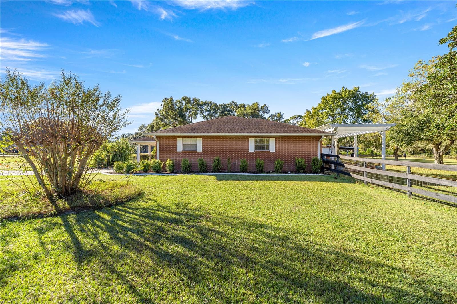 SIDE VIEW OF THE HOUSE AND GROUNDS - 9812 SW 74TH AVE, OCALA