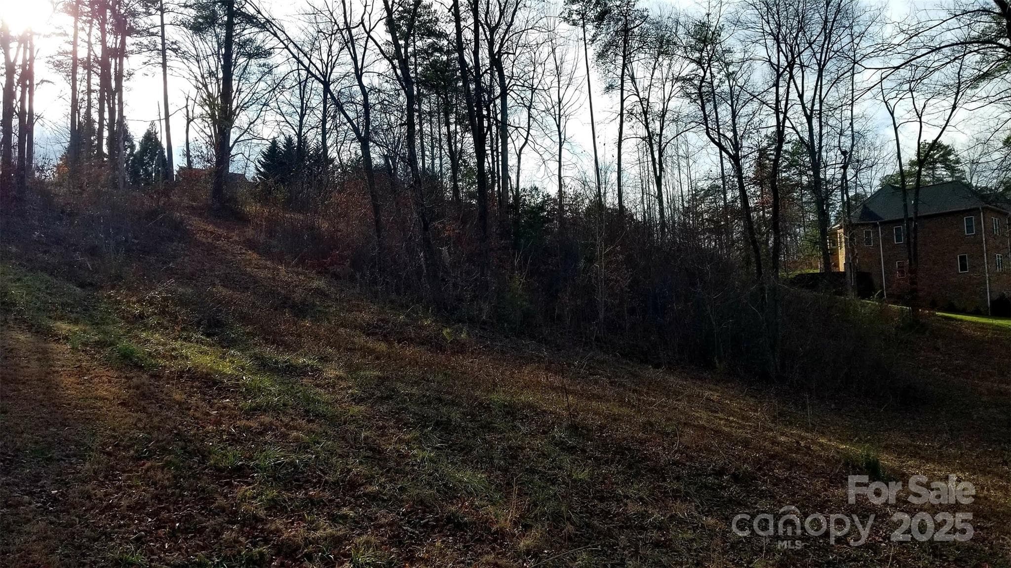 .91 acre cul-de-sac lot 124 with sloping topography conducive to a basement foundation plan overlooking the golf course - Morganton