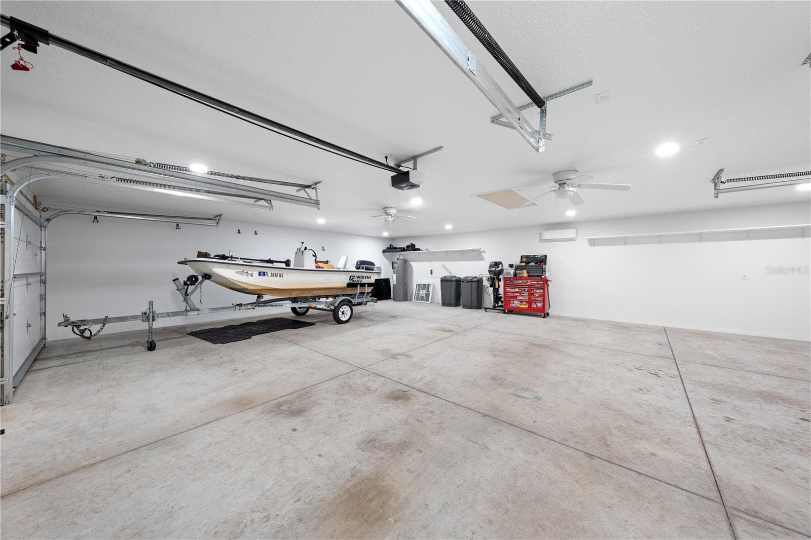 Inside of garage with bathroom, a/c, attic space, electric and water that is attached to the in-law suite - 4055 EDSEL AVE, ST CLOUD