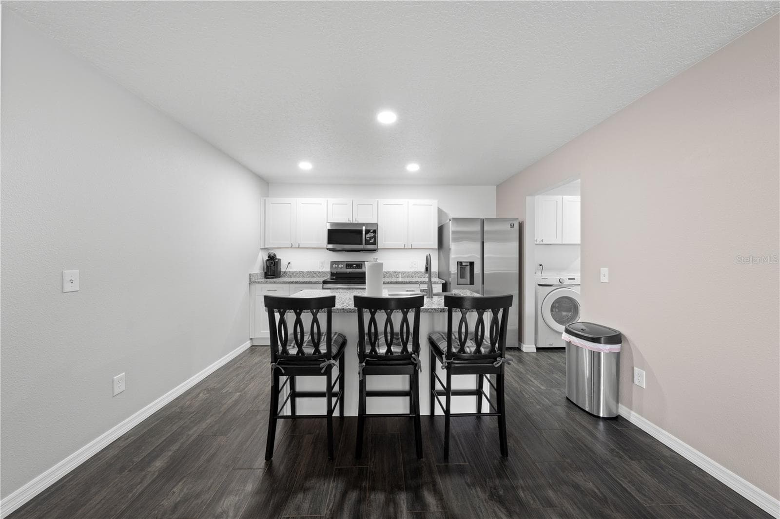 In-law suite view of kitchen rooms from dining area. - 4055 EDSEL AVE, ST CLOUD