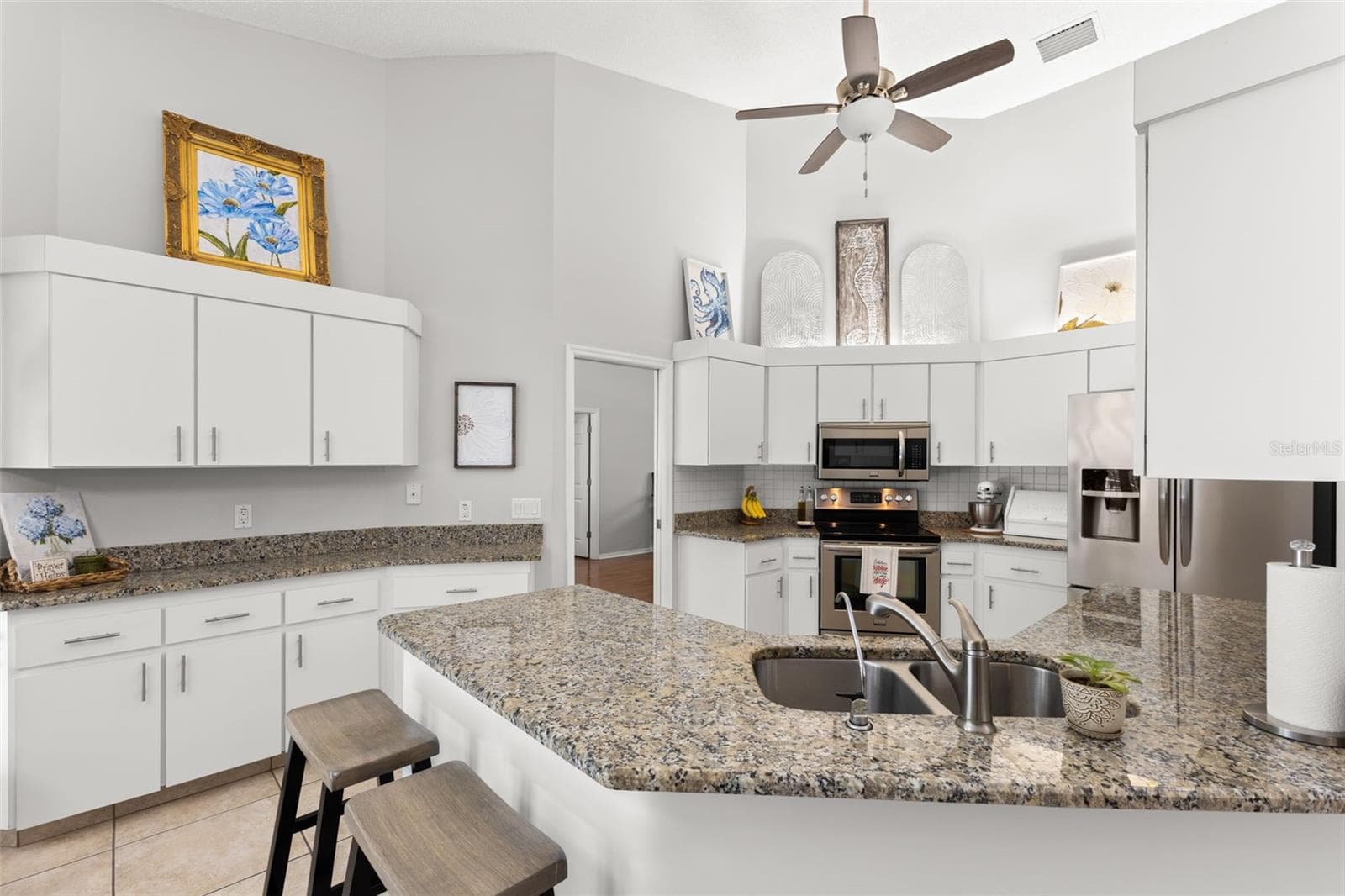 Kitchen from dining area - 3734 THORNBUSH LN, NEW PORT RICHEY