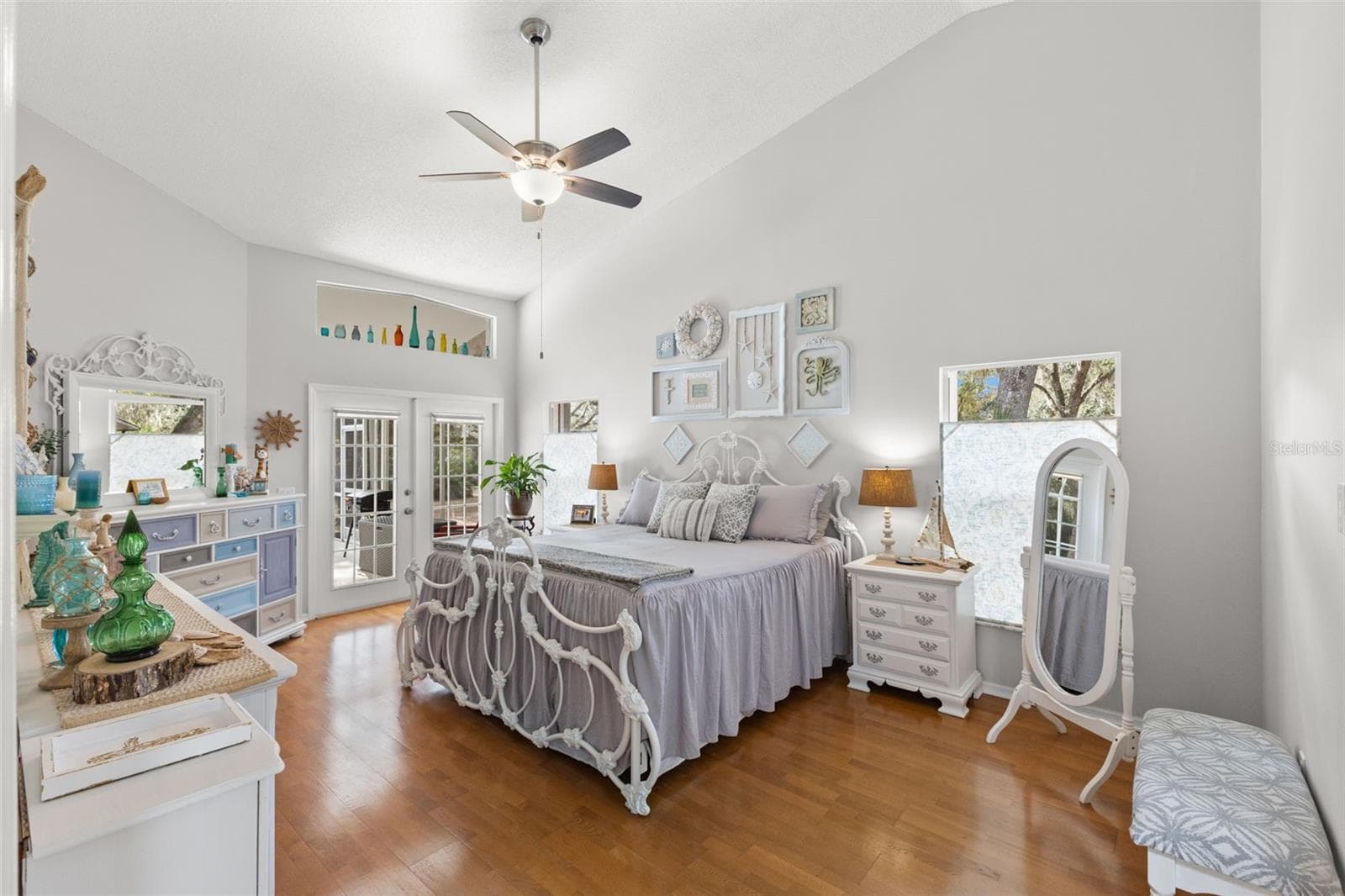 Primary bedroom with french doors leading out to the pool area - 3734 THORNBUSH LN, NEW PORT RICHEY