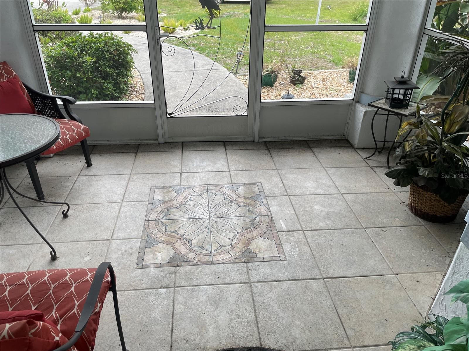 FOYER EBTRANCE SCREENED TILE INLAY - 18029 OHARA DR, PORT CHARLOTTE