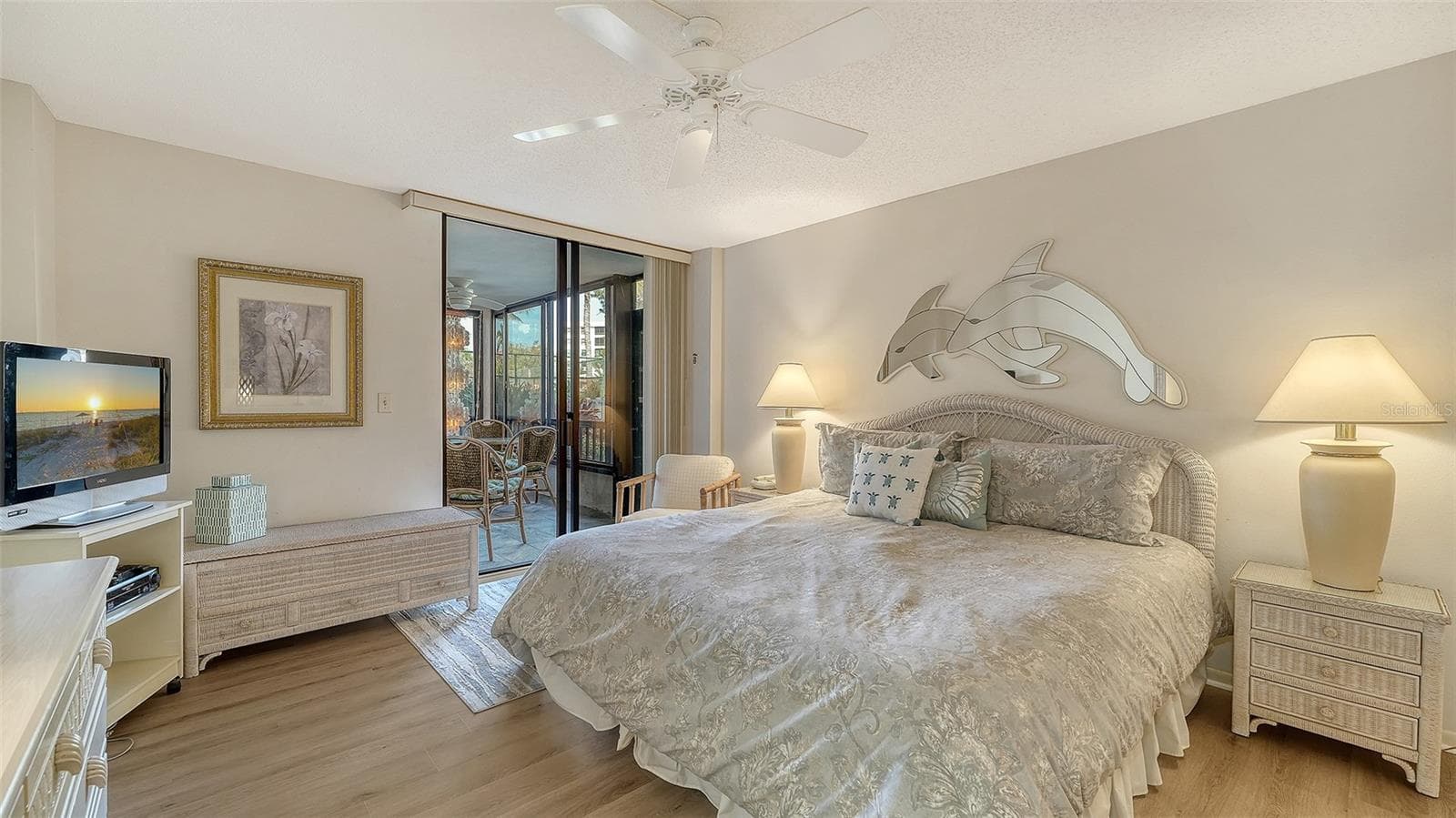 Primary Bedroom-view to lanai and pool - 8773 MIDNIGHT PASS RD #102G, SARASOTA