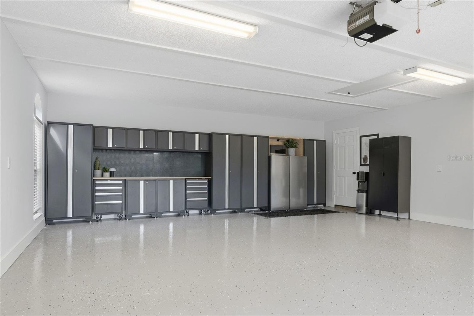new cabinets and fresh epoxy flooring - 6349 RAVENWOOD WAY, SARASOTA