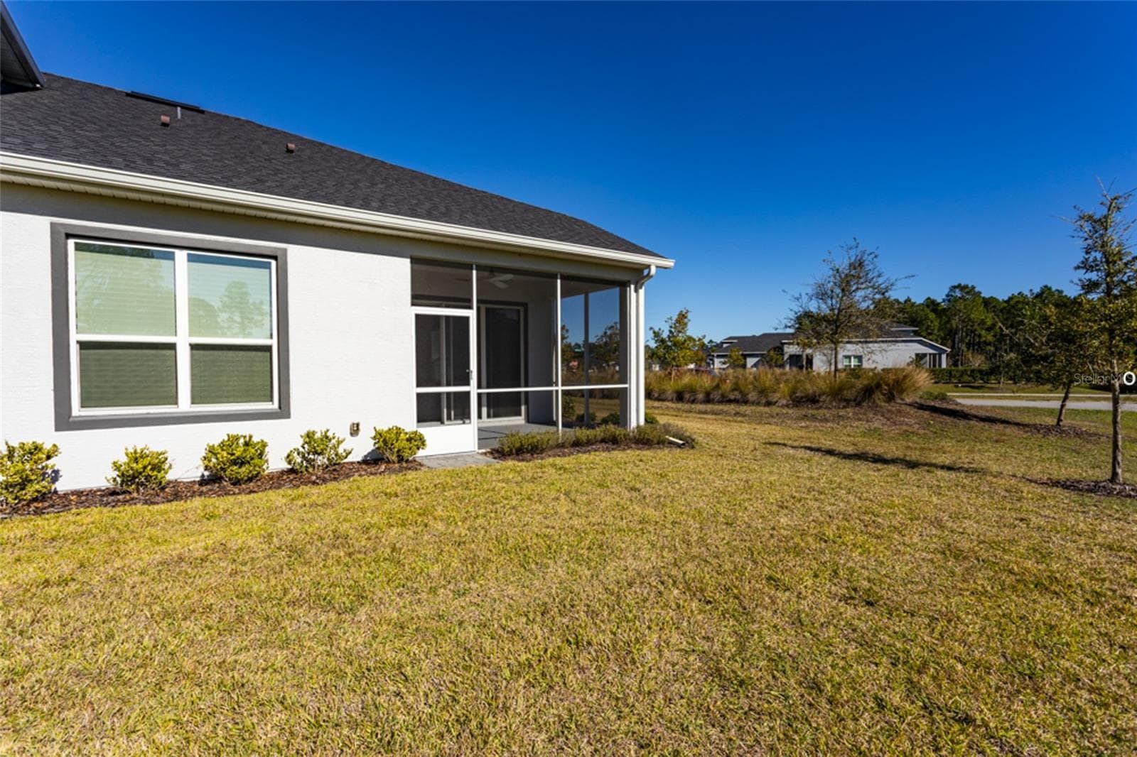 View of the back of the home. Enjoy the yard and let the HOA maintain it! - 3 NEWHAVEN LN, ORMOND BEACH