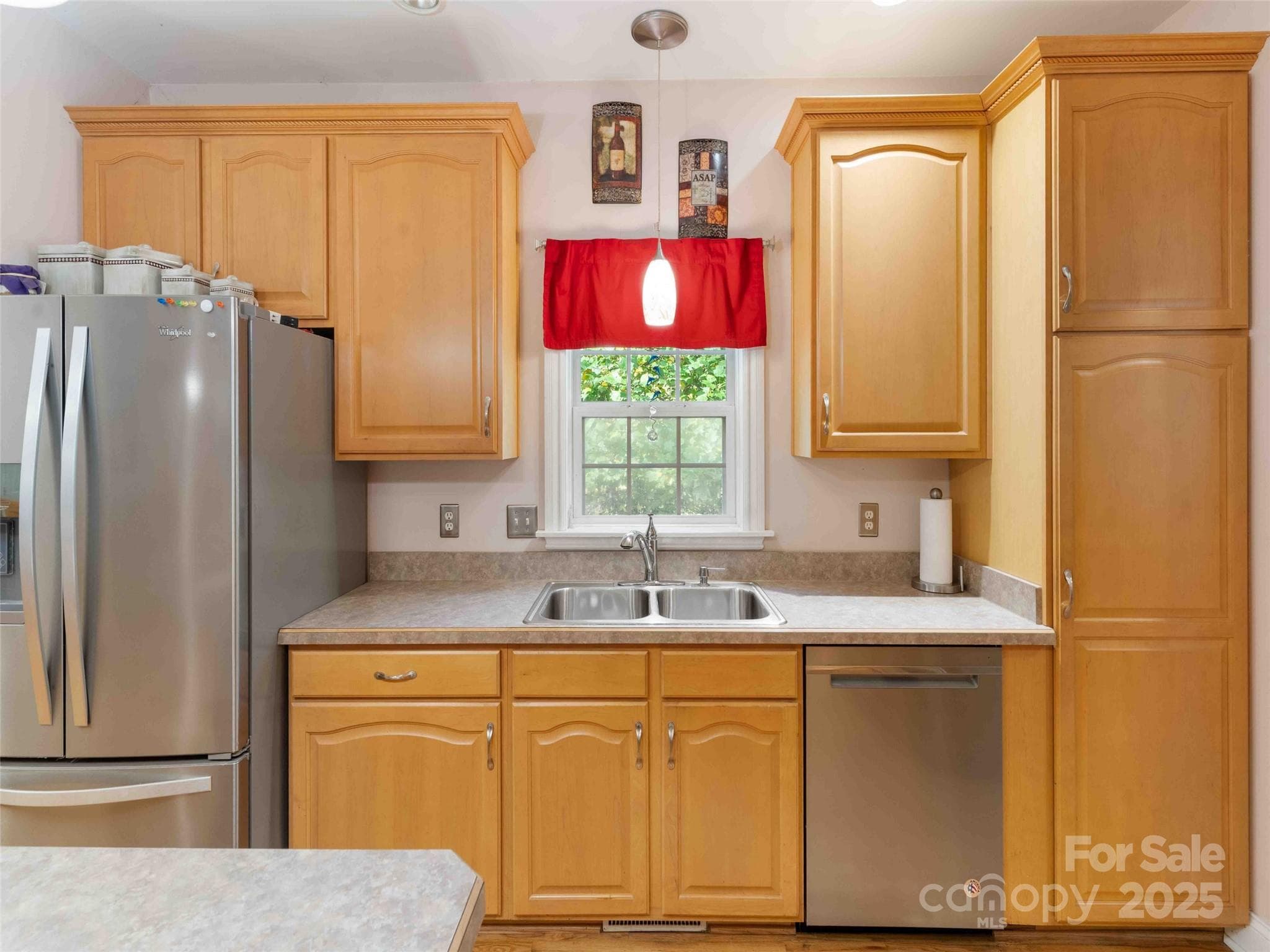 Bright kitchen with ample cabinetry and workspace for daily living and entertaining. - Pisgah Forest