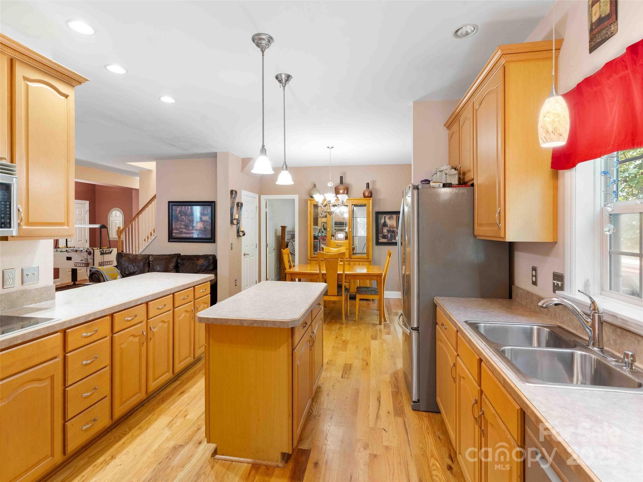 Bright kitchen with ample cabinetry and workspace for daily living and entertaining. - Pisgah Forest
