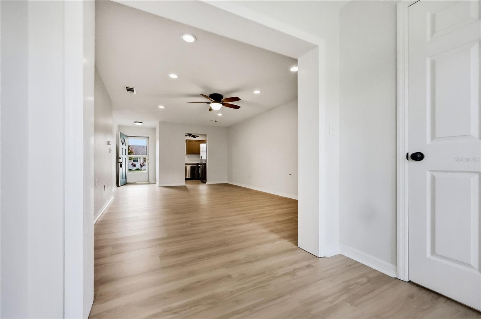 Living room/dining room view from sun room - 249 N HILL AVE #30, DELAND