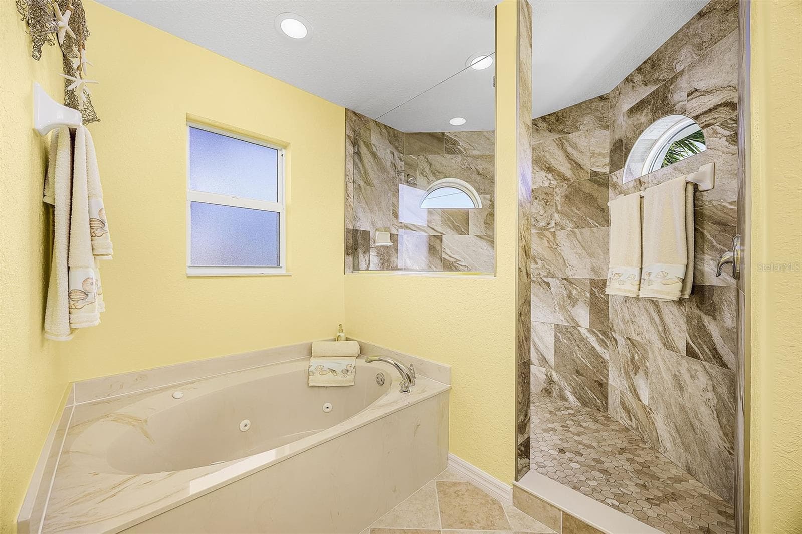 Primary bath with walk in shower and Jet Jacuzzi tub - 430 NW 39TH AVE, CAPE CORAL
