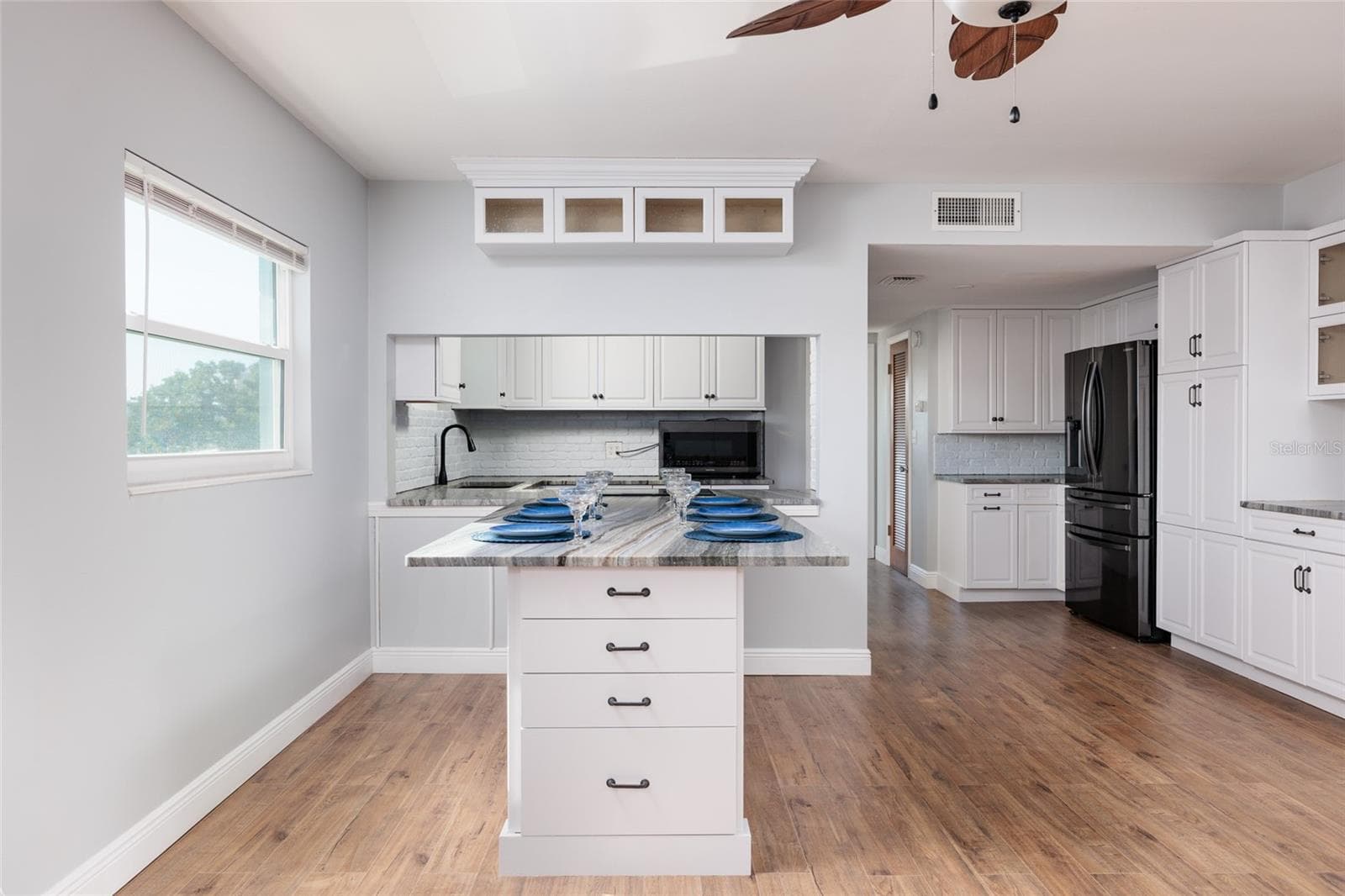Dining area & Kitchen. Built-in granite table w/drawers & pull out shelves. - 6000 2ND ST E #6, ST PETE BEACH