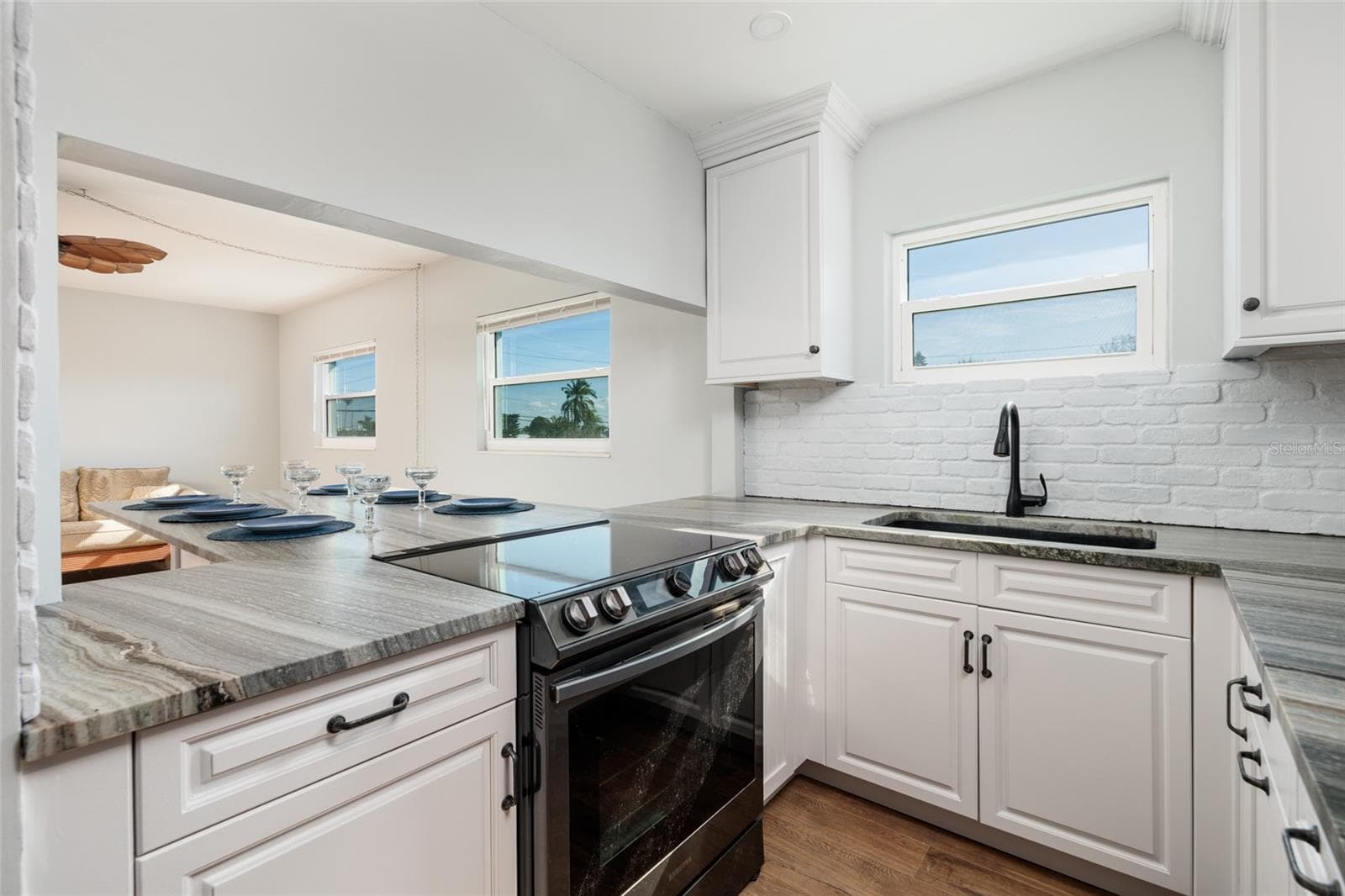 Kitchen w/convection over, granite counters. - 6000 2ND ST E #6, ST PETE BEACH