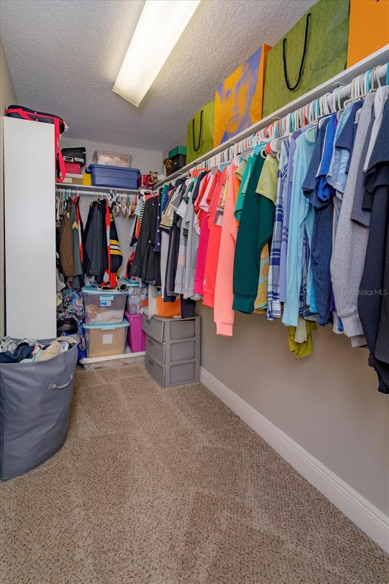 upstairs walk in closet - 5341 FAWN WOODS CT, SANFORD