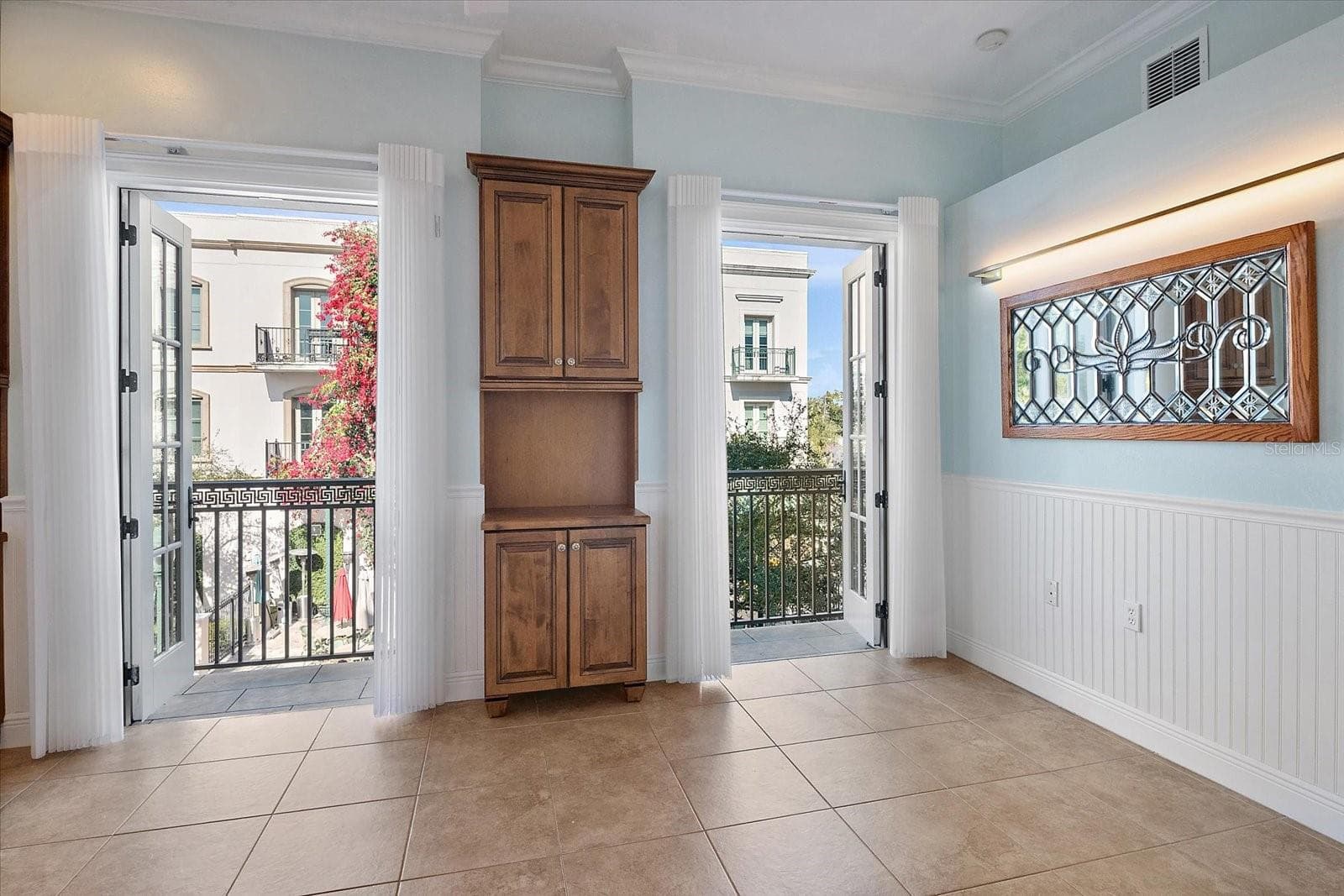 Living space with French doors and courtyard access - 445 N ORANGE AVE #210, SARASOTA