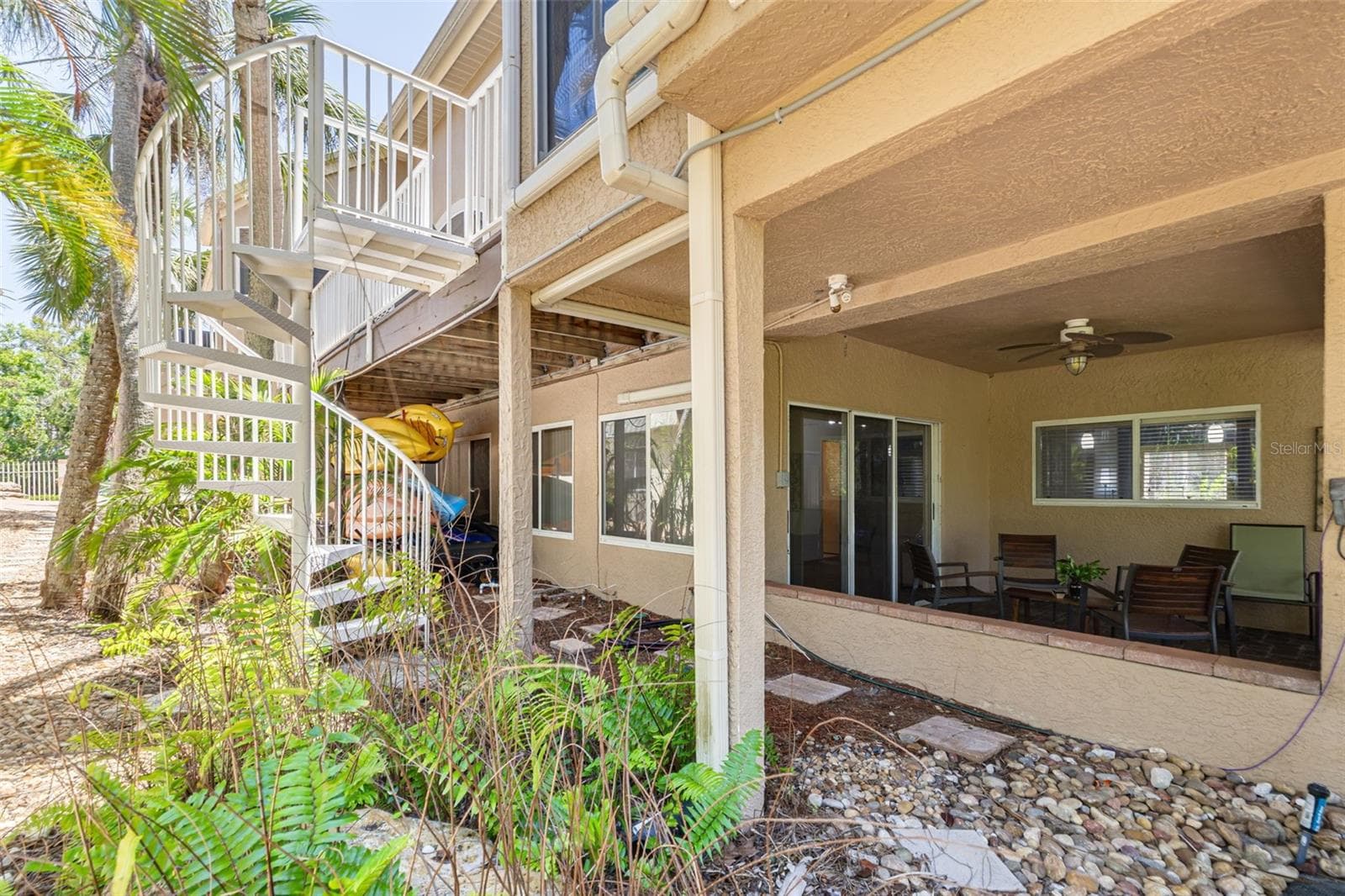 Spiral stairs from elevated deck to lower level patio - 2613 59TH ST S, GULFPORT
