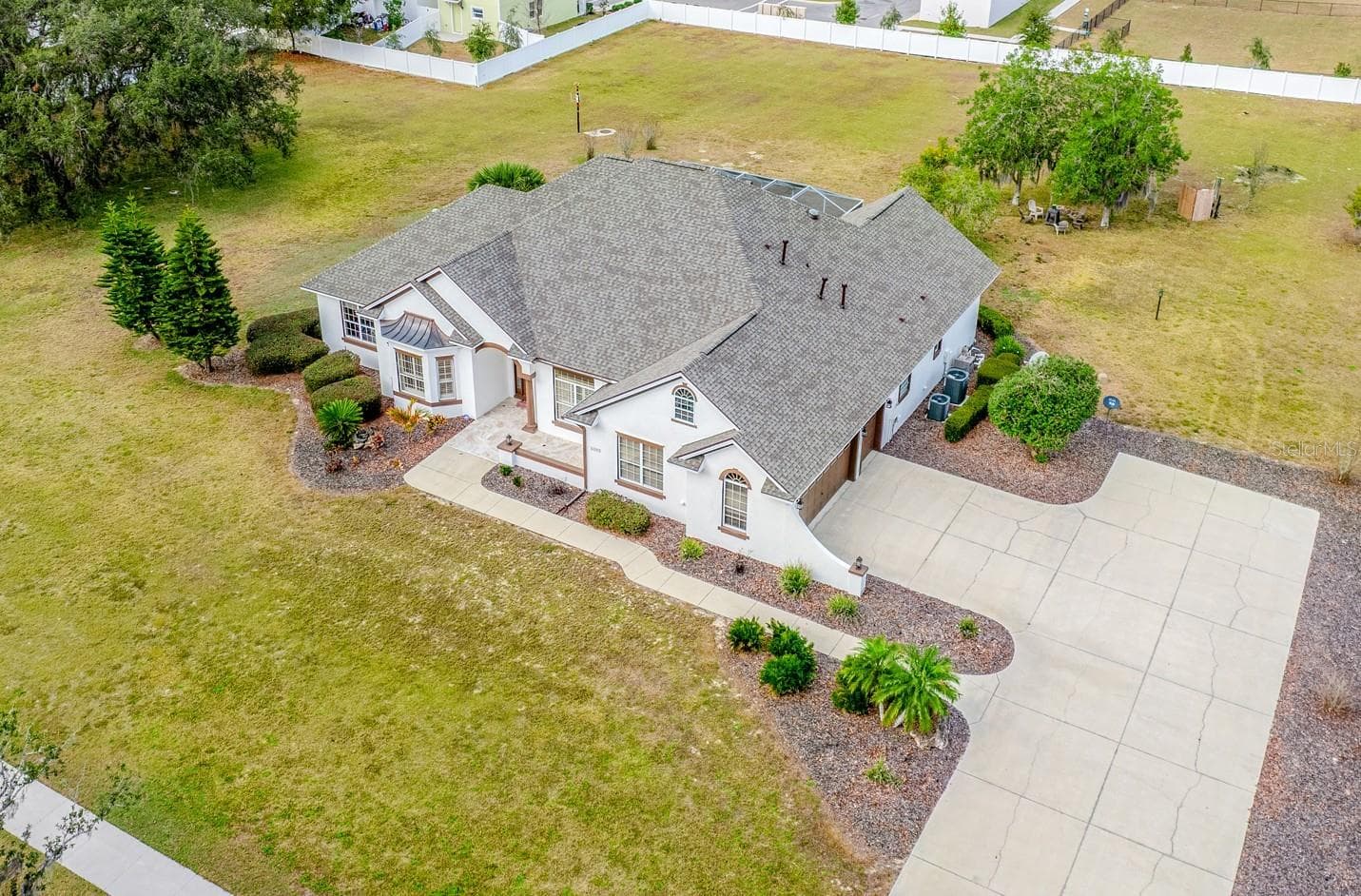 Set on two spacious lots totaling 2.28 ACRES, this one-of-a-kind ESTATE HOME in Wildwood delivers the rare combination of luxury, land, and freedom – NO HOA, golf-cart friendly, and just 2.2 miles from Brownwood Paddock Square in The Villages! - 5092 NE 81ST BLVD, WILDWOOD