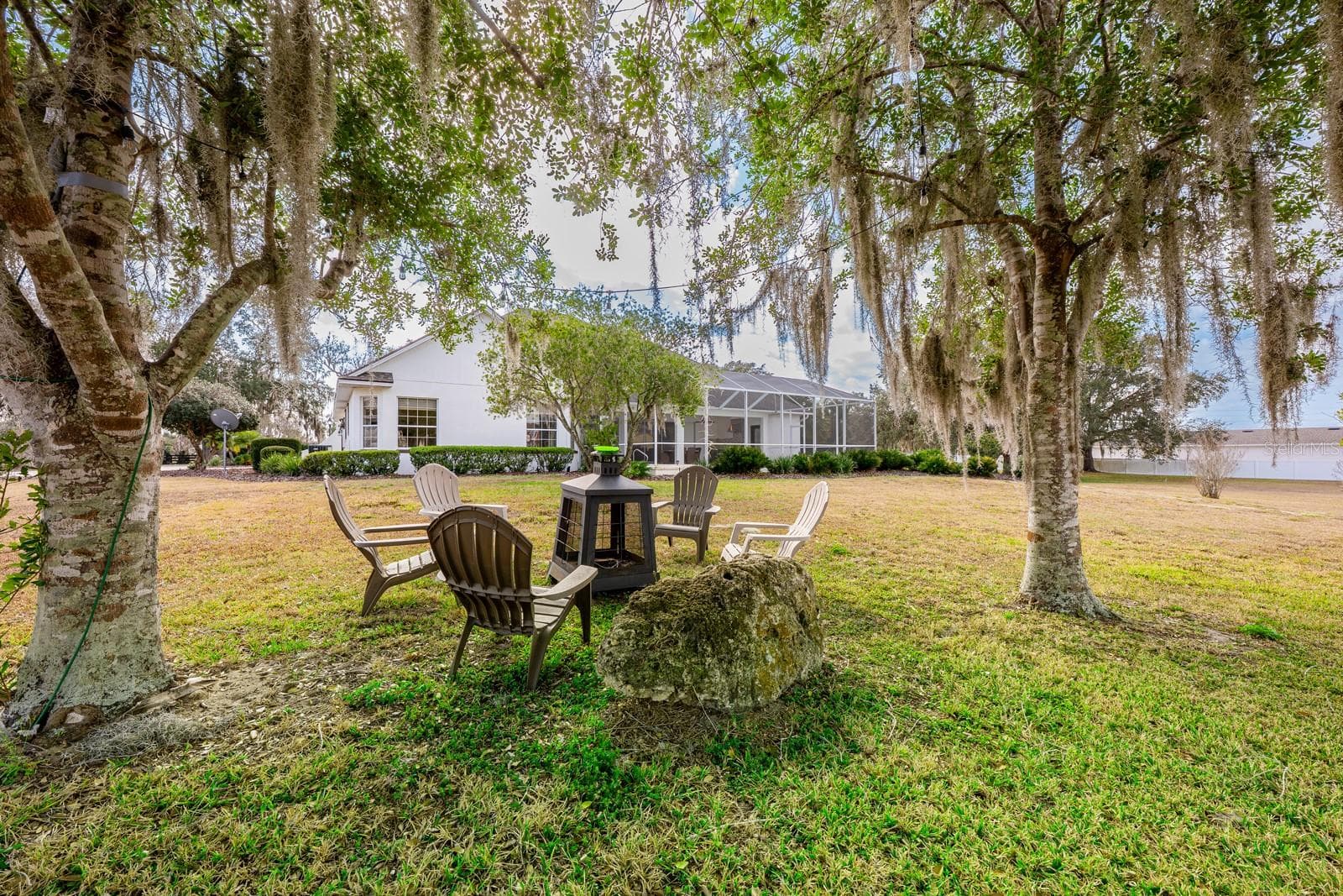 Relax and unwind under the beauitful mature trees. - 5092 NE 81ST BLVD, WILDWOOD