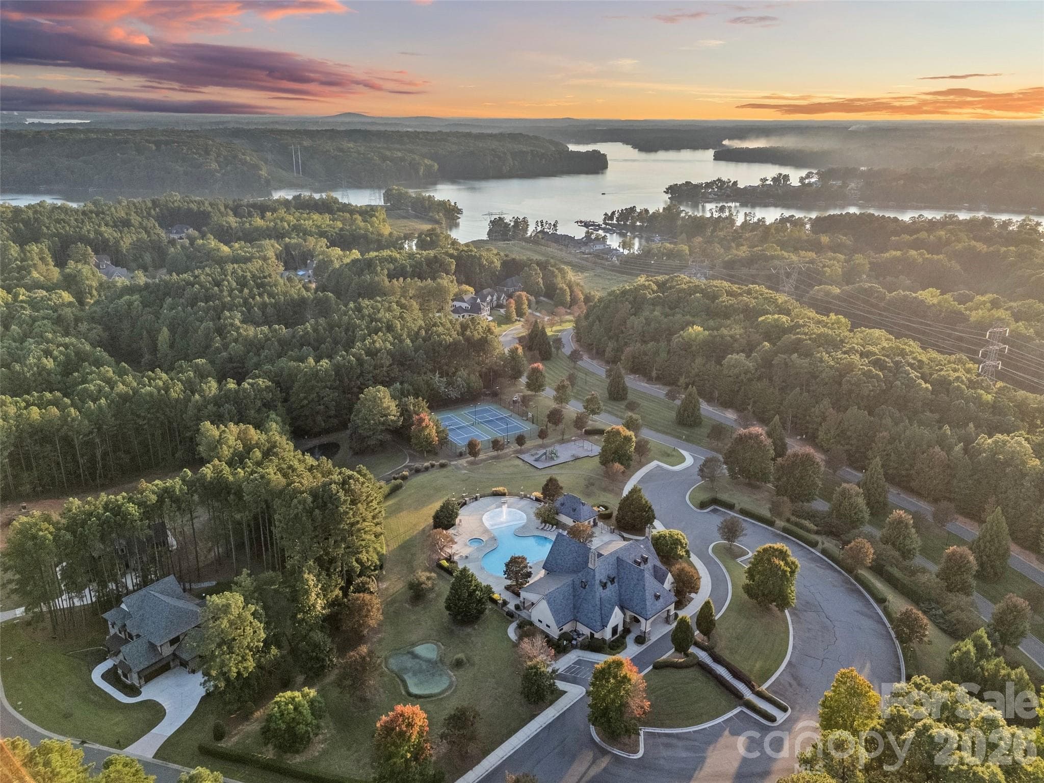Neighborhood amenities include gated community, Lake Wylie waterfront, clubhouse, lagoon swimming pool, lighted tennis & pickleball courts, walking paths, beach area on Lake Wylie, playground, boat storage, boat slips, boat launch canoe, kayak dock & storage & pavilion. - 6032 Headlands Court, Belmont