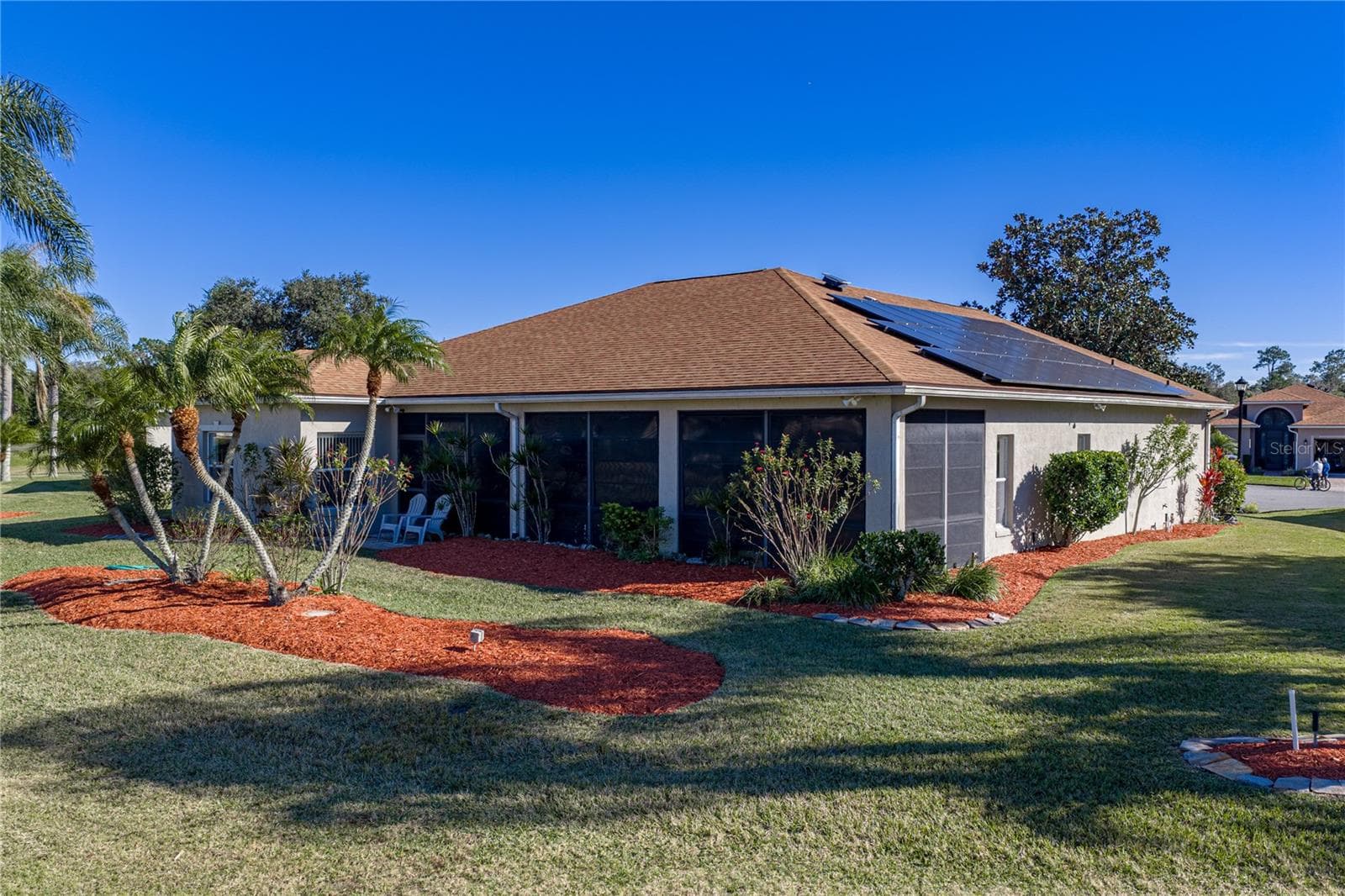 The rear of the home has a small patio area just outside the lanai. - 4360 ASHTON CLUB DR, LAKE WALES