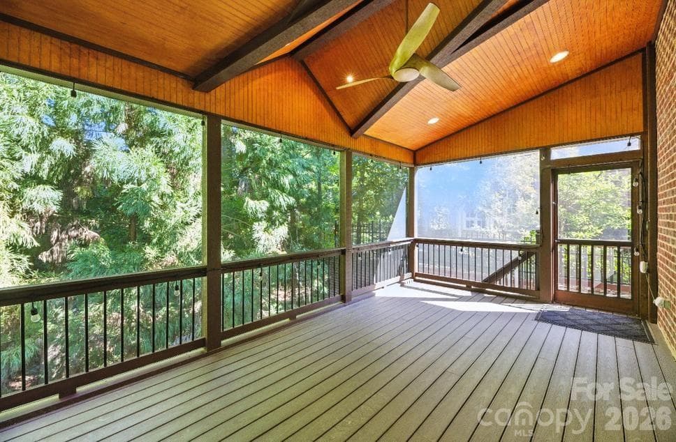 Enclosed screened in deck off of living room. - Charlotte