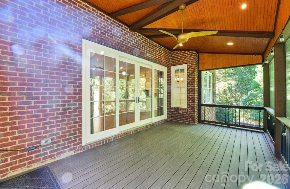 Enclosed screened in deck off of living room. - Charlotte