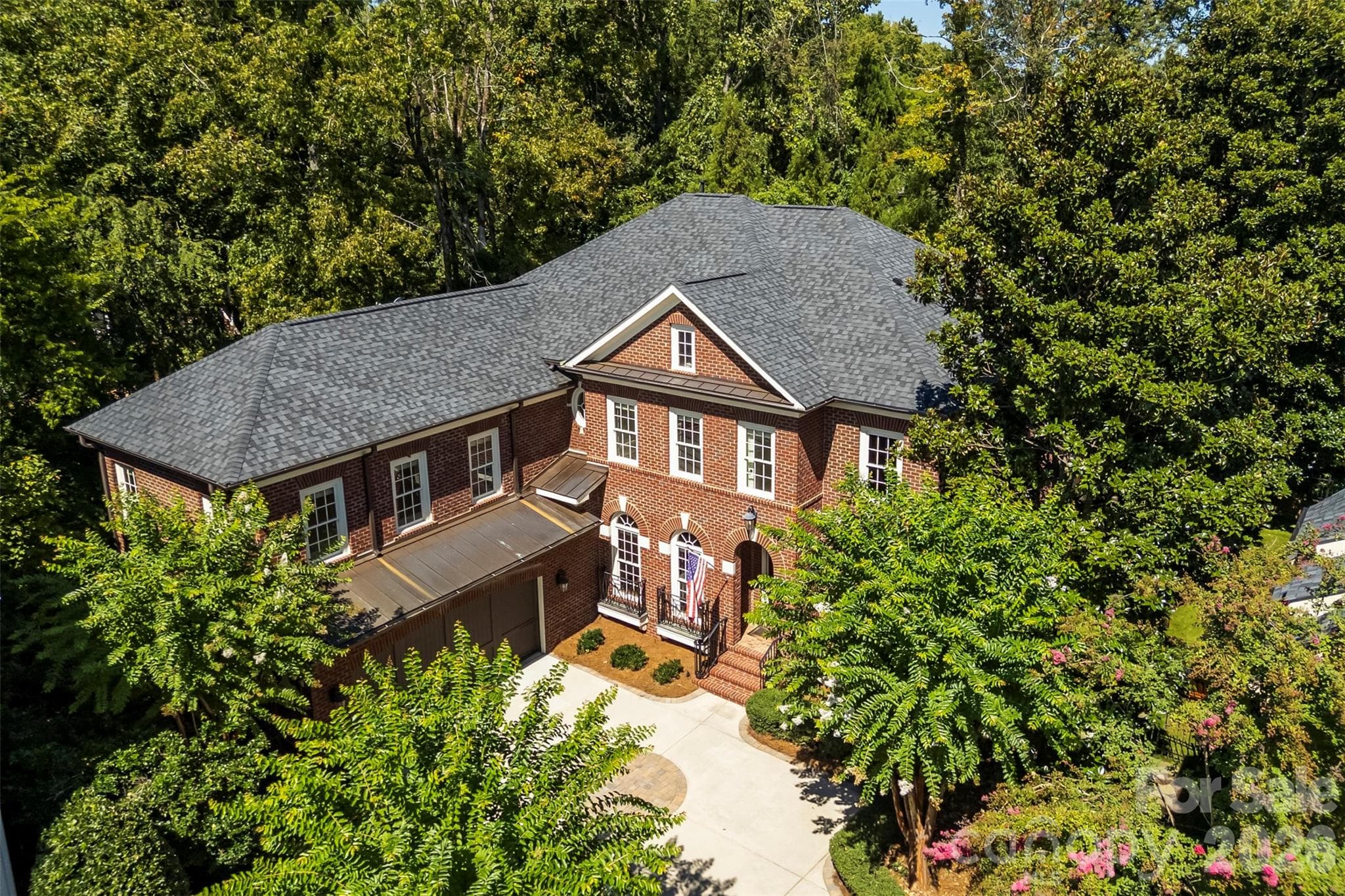 Arial view of a all brick home. - Charlotte