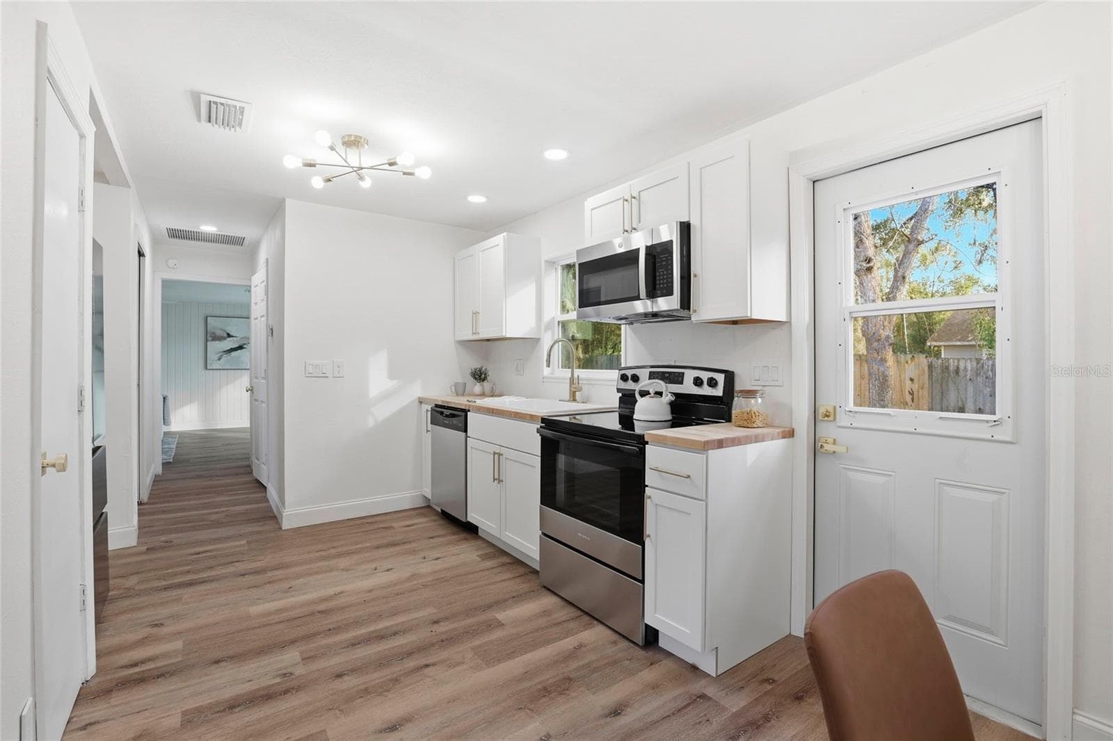 Brand-new kitchen with stainless steel appliances and butcher block counters - 425 SE 2ND ST, WILLISTON