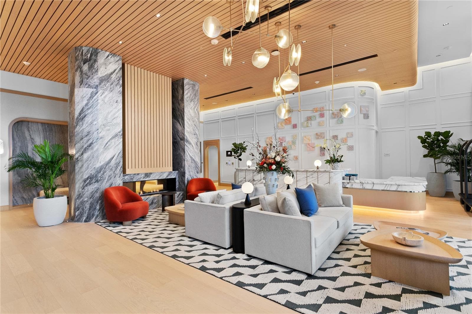 Elegant double-height lobby with curated furnishings and concierge reception - 3015 S YSABELLA AVE #2301, TAMPA