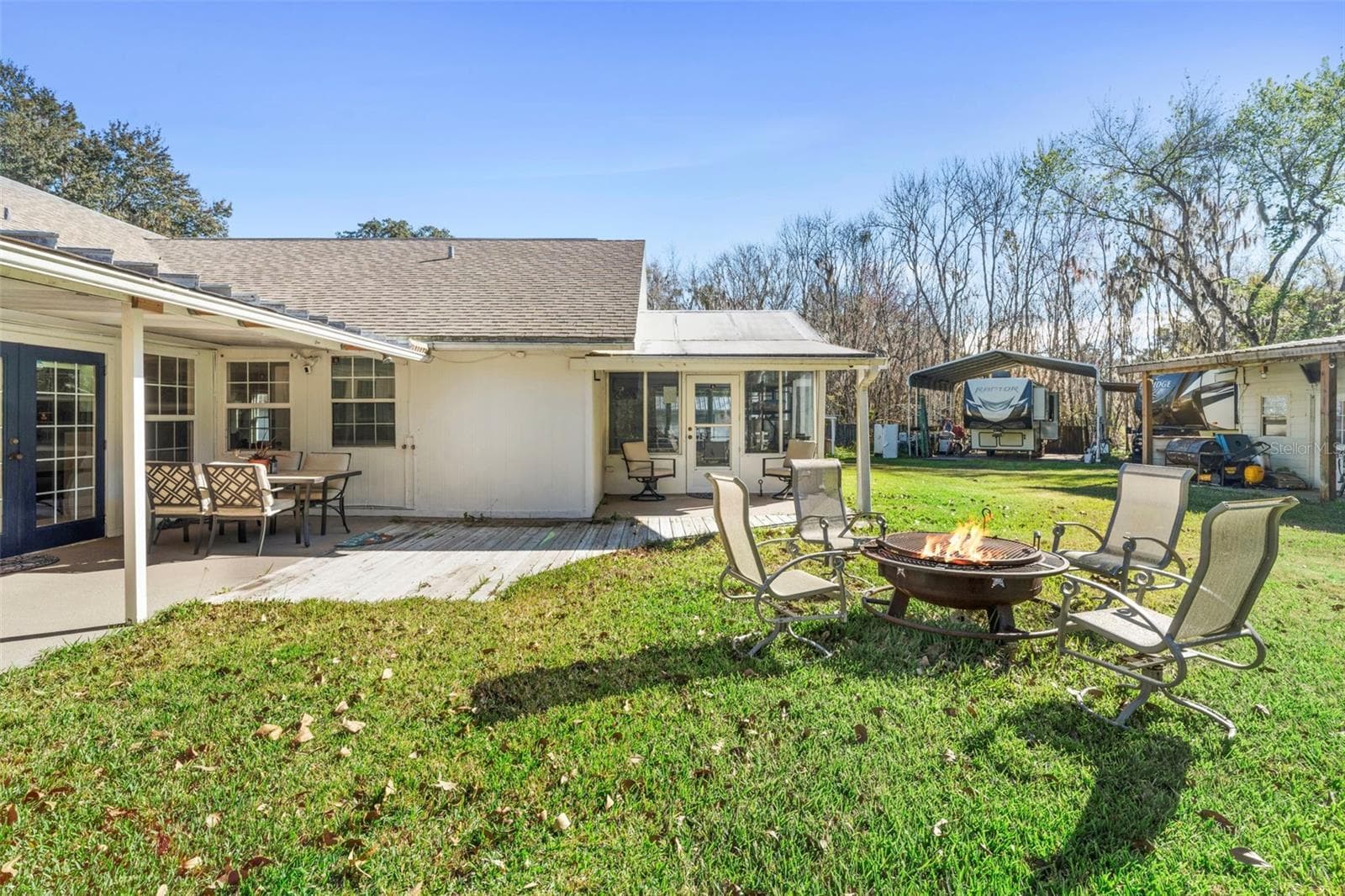 Back Patio with fire pit - 3080 RAGIS RD, EDGEWATER