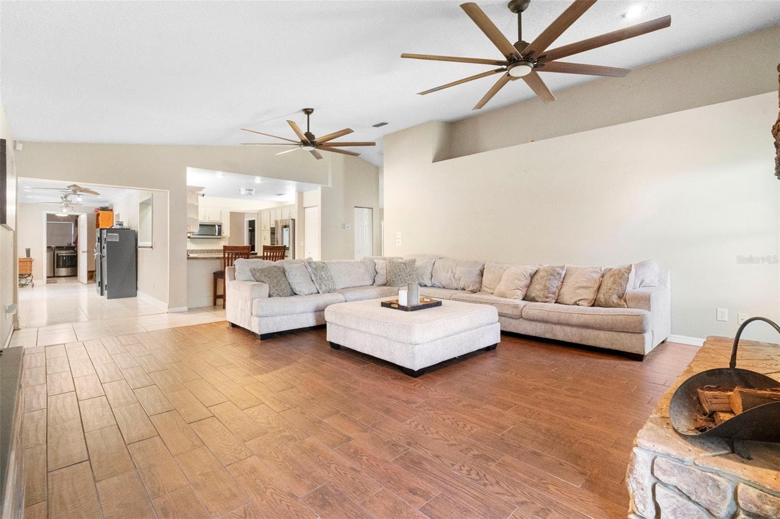 Living room with wood burning fire place - 3080 RAGIS RD, EDGEWATER