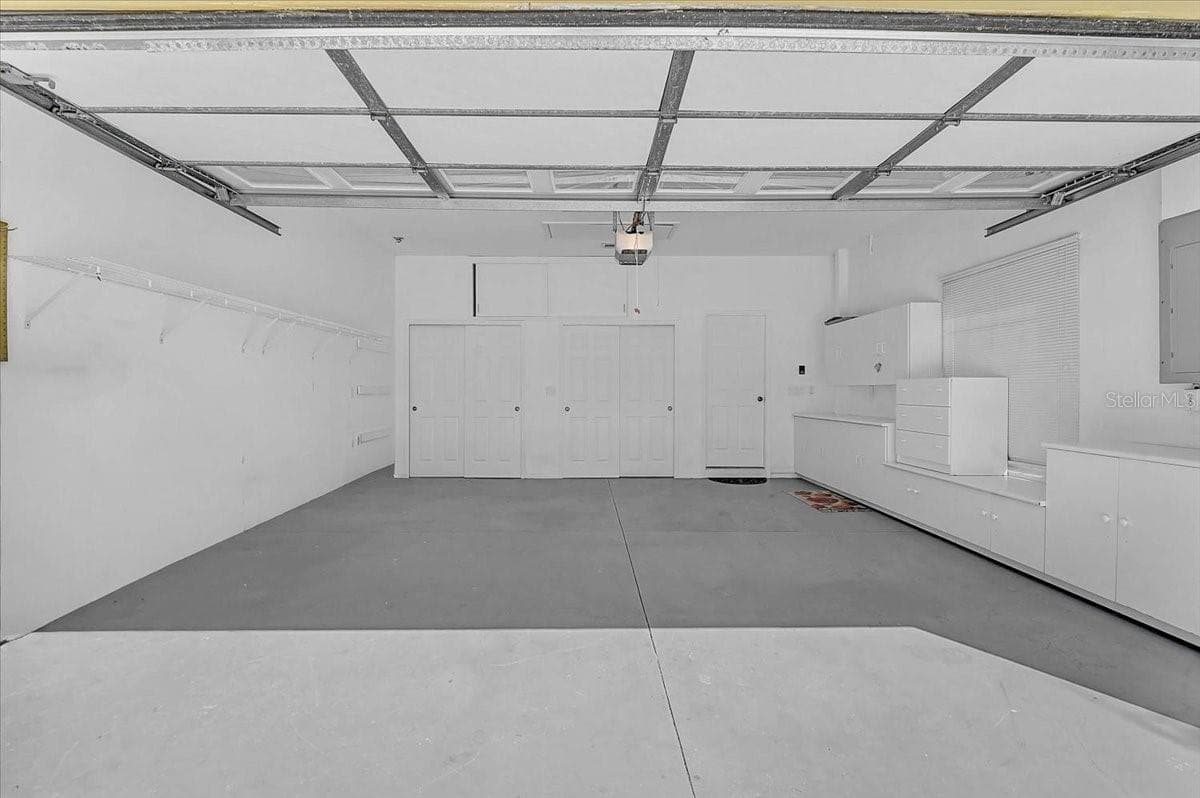 Garage with Built-In Cabinets - 4031 CADDIE DR E, BRADENTON