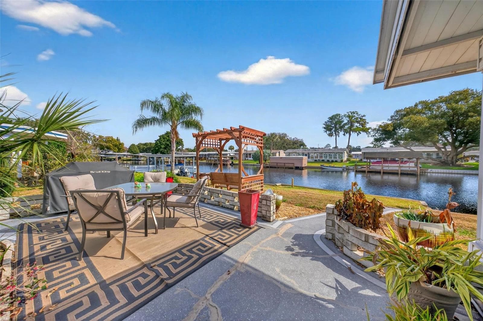 Outdoor patio with water view - 1018 SOUTHLAND DR, TAVARES