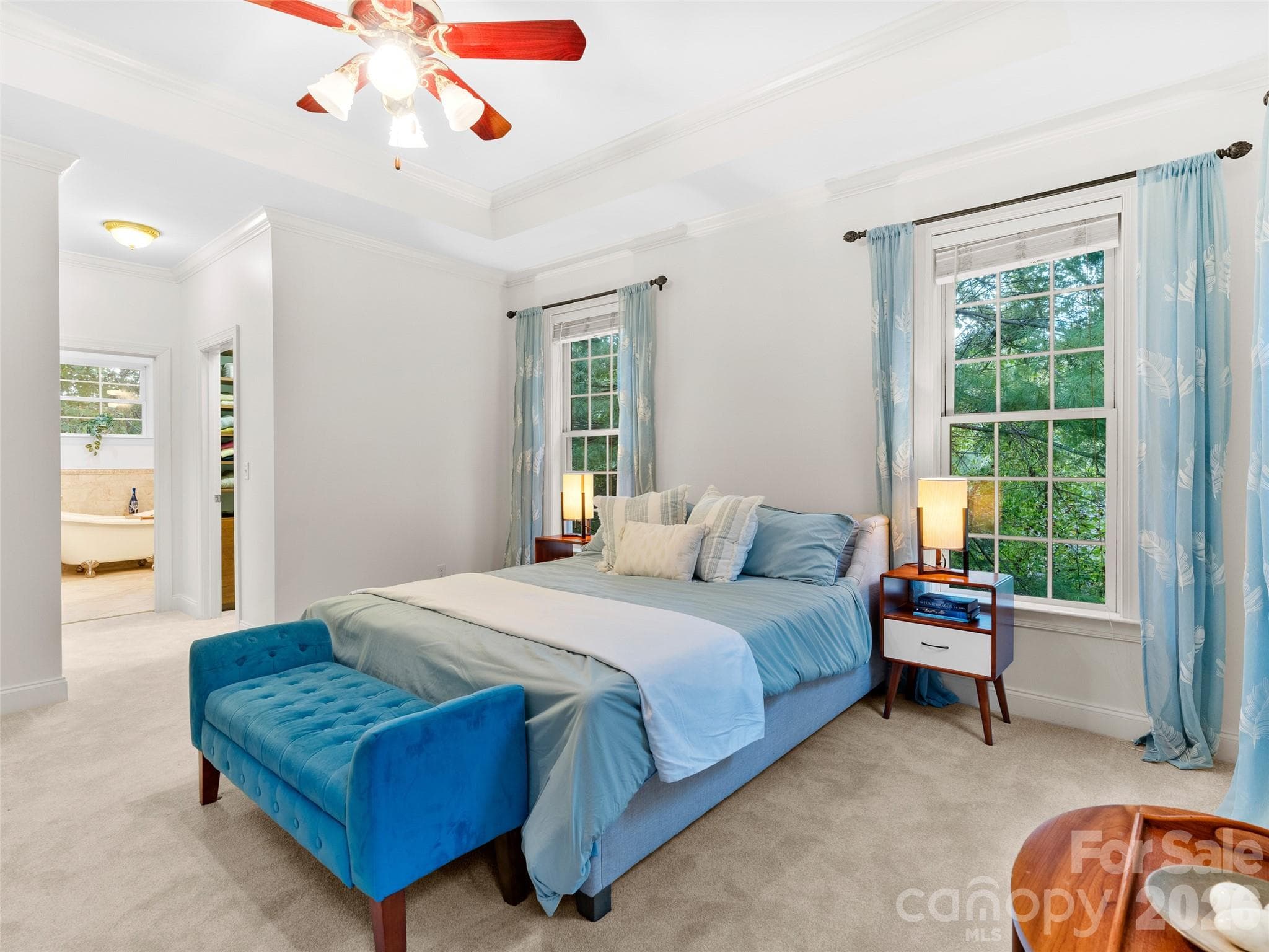 Designed for comfort and ease, the main-level master suite features seamless access to the master bath and generous walk-in closets, making daily routines effortless. - Asheville