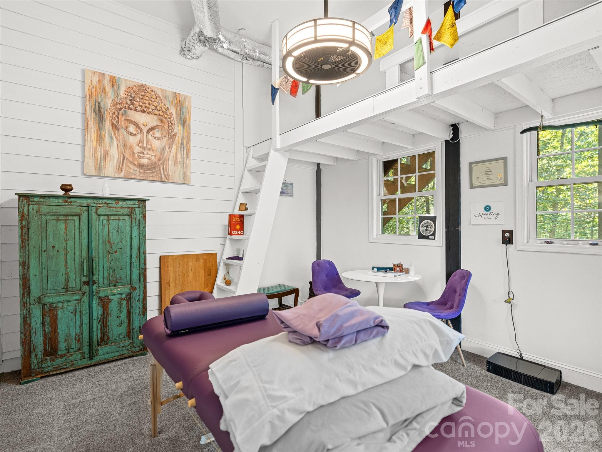 This dedicated Reiki room offers a peaceful, calming space designed for relaxation, meditation, or energy work, creating a true personal retreat within the home. - Asheville