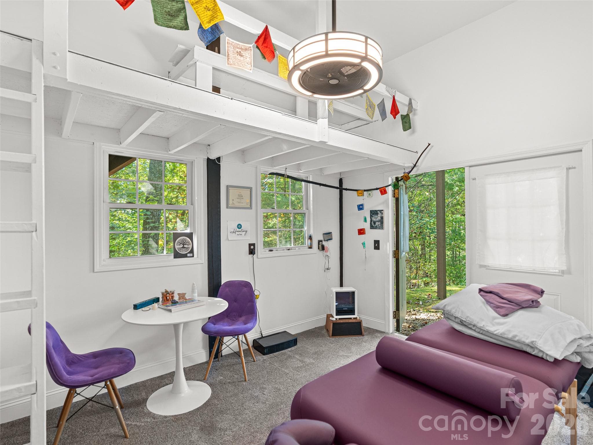 Filled with natural light and tranquility, the Reiki room provides a mindful feature to the home. - Asheville