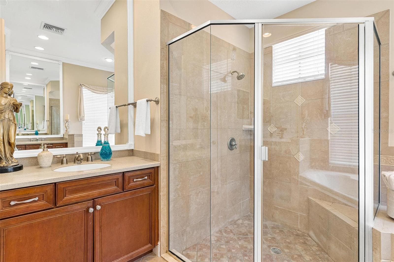 Separate glass walk in shower plus raised vanity.... - 26309 SAN GABRIEL, HOWEY IN THE HILLS