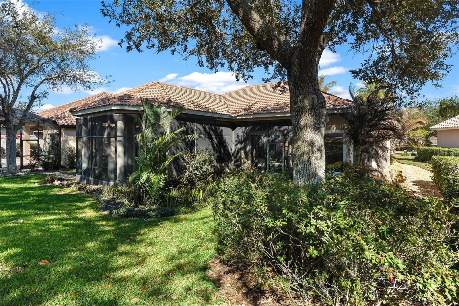 Backyard view...Lush Landscaping! - 26309 SAN GABRIEL, HOWEY IN THE HILLS