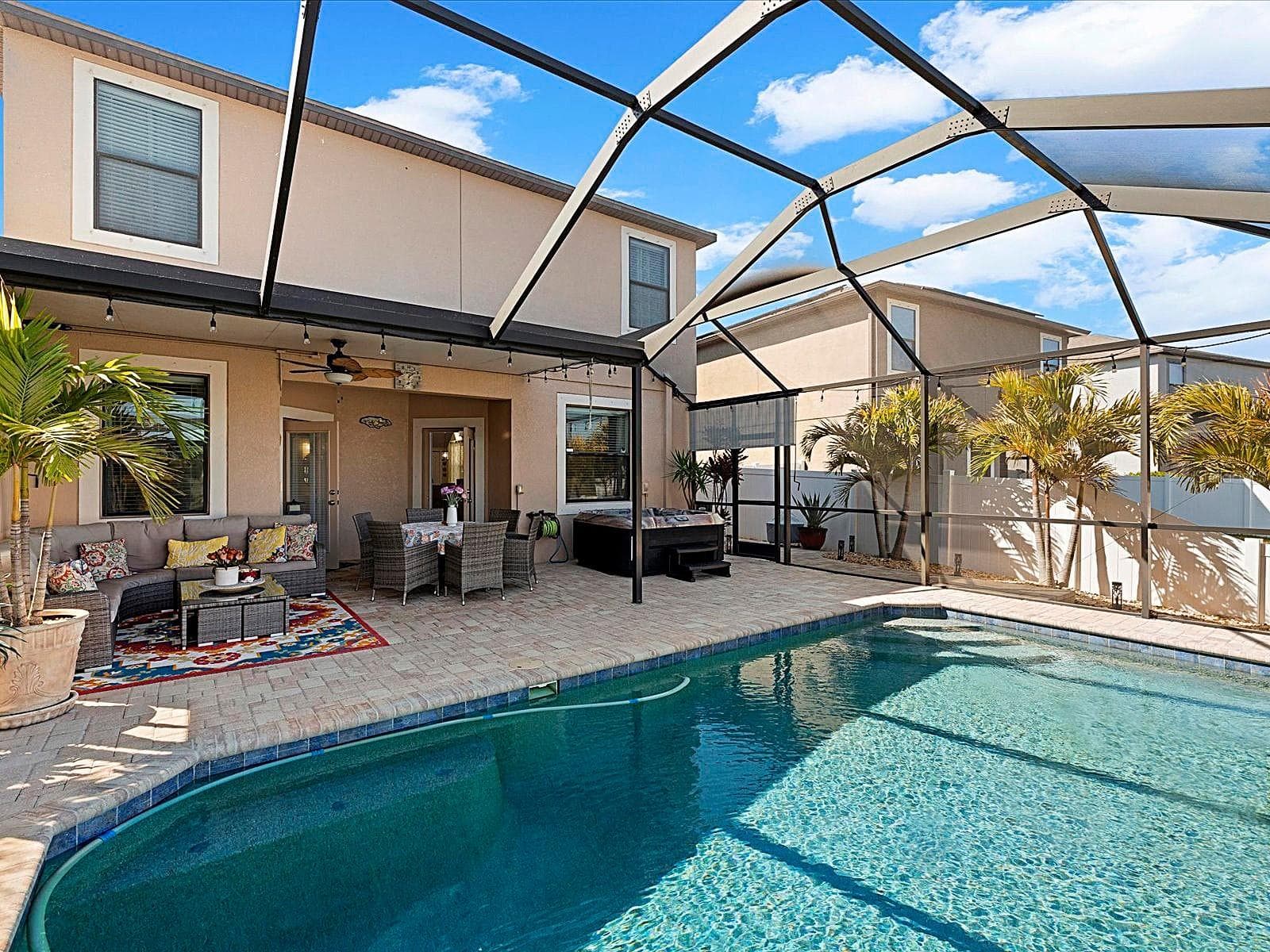 Covered Lanai overlooking pool and pond - 1716 HADDEN HALL PL, TRINITY