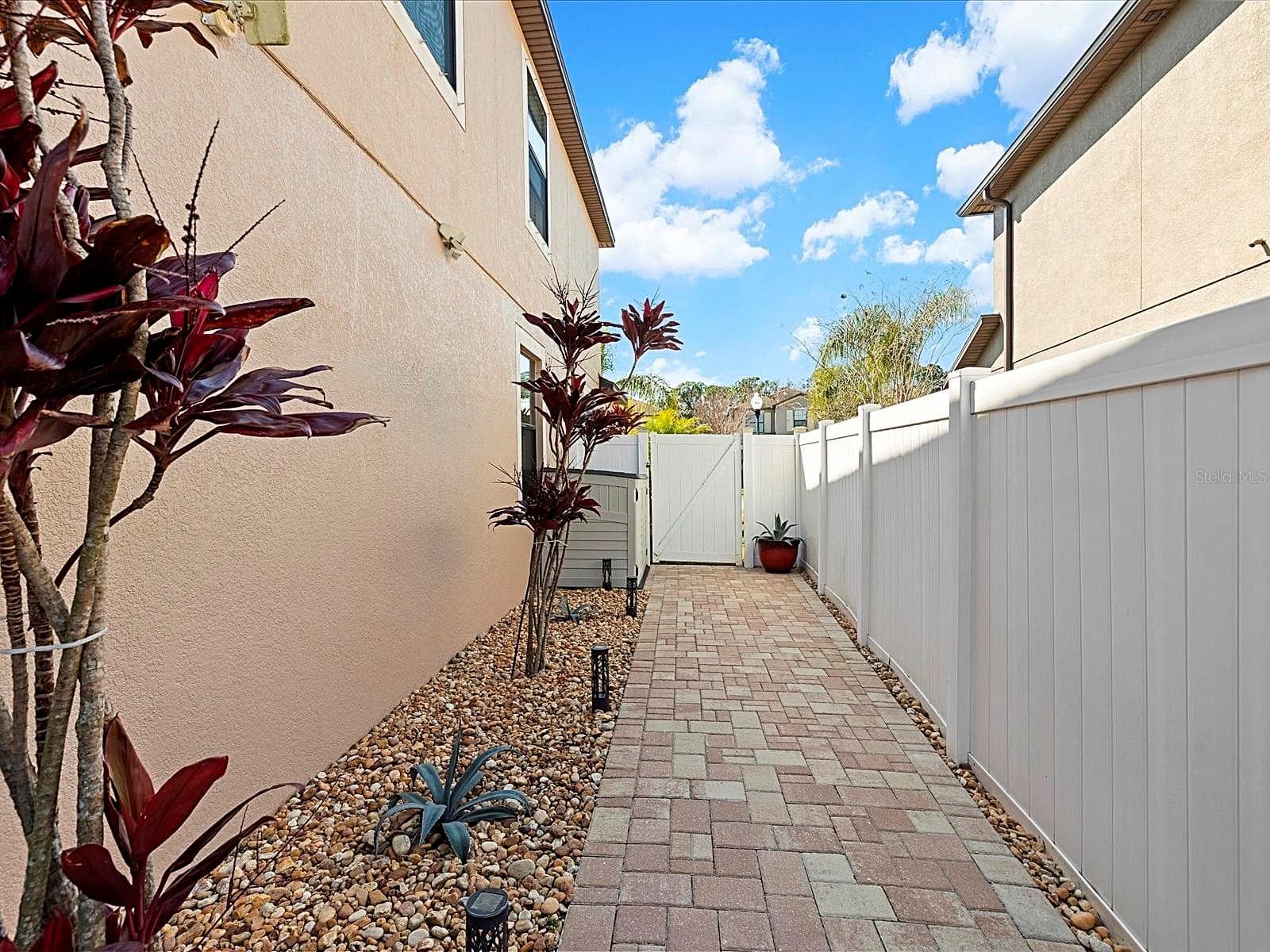 Low-maintenance paved side-yard area - 1716 HADDEN HALL PL, TRINITY