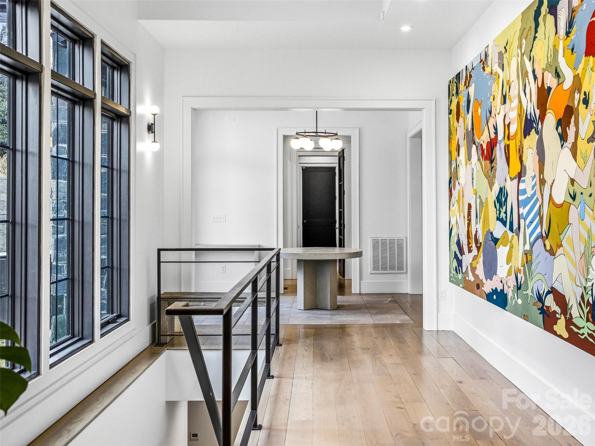 Open hallway highlighted by oversized windows and contemporary architectural lines. - 241 Tower Circle, Hendersonville