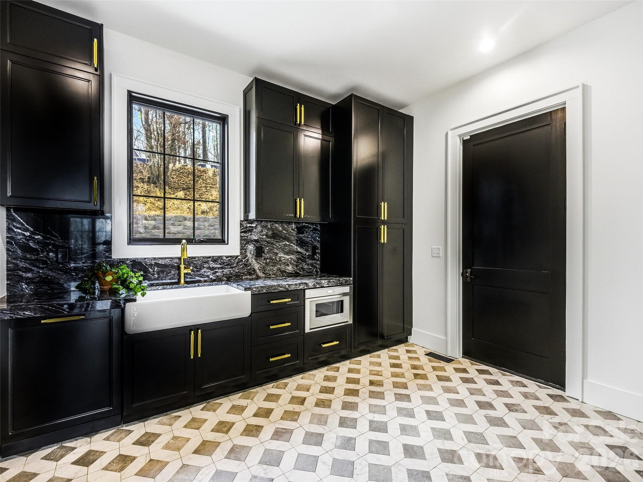 Stylish butler’s pantry with custom cabinetry, sink, and ample storage, a 2nd farmhouse sink, microwave, and a 2nd dishwasher. - 241 Tower Circle, Hendersonville